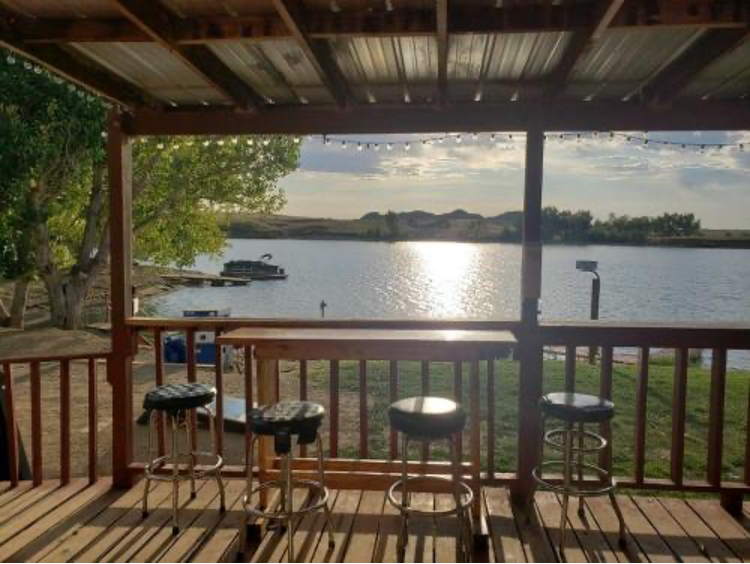 A cabin porch overlooking the lake at Rock Creek Marina